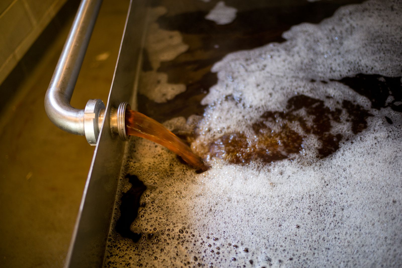 The fresh boiling wort is being pumped onto the coolship.