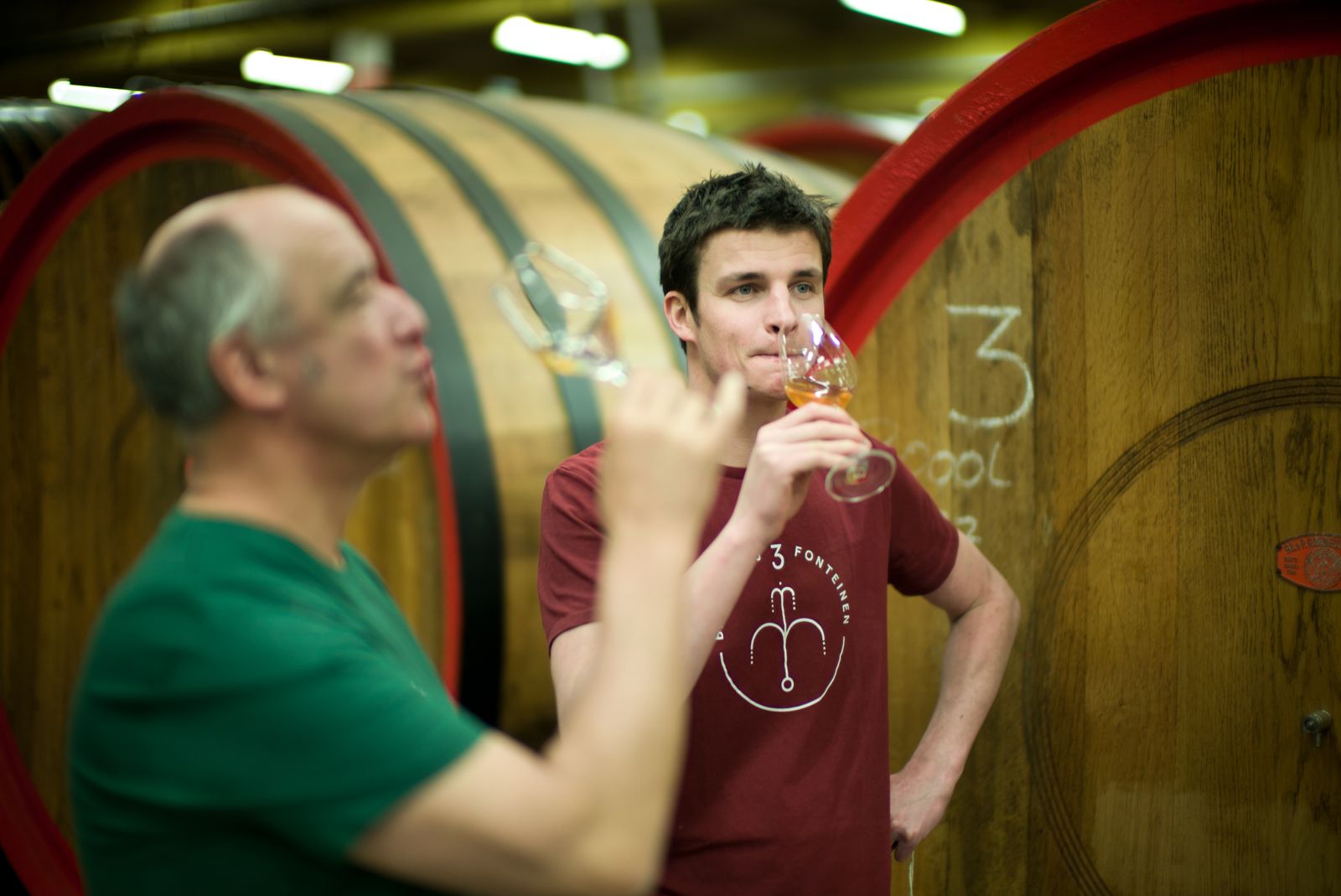 Armand and Michaël, sampling old lambics together and deciding what to create with them.